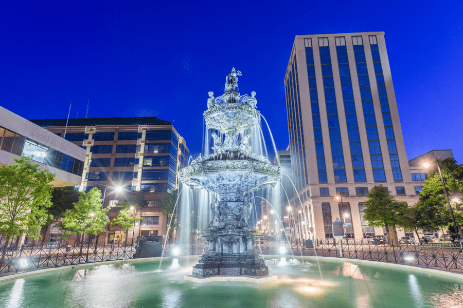 View of Montgomery's Court Square Fountain at night, symbolizing the city's charm and appeal for real estate investment.